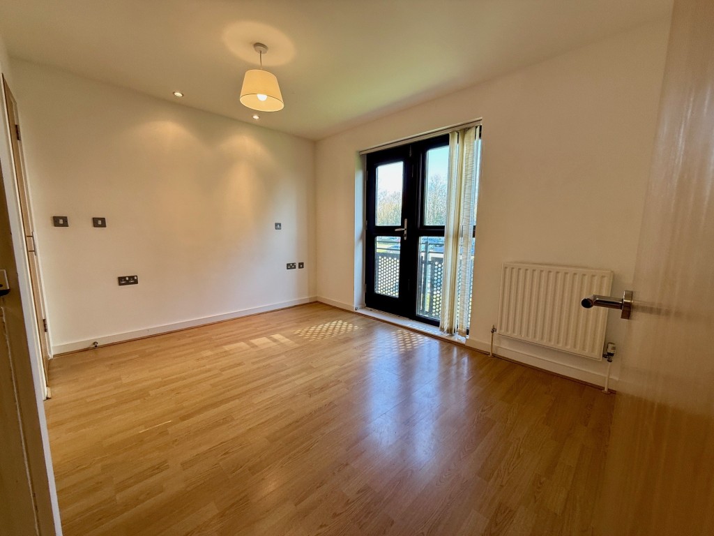 Lot: 105 - SECOND FLOOR FLAT WITH EN-SUITE TO MASTER BEDROOM - Master bedroom with doors to en suite and Juliet balcony